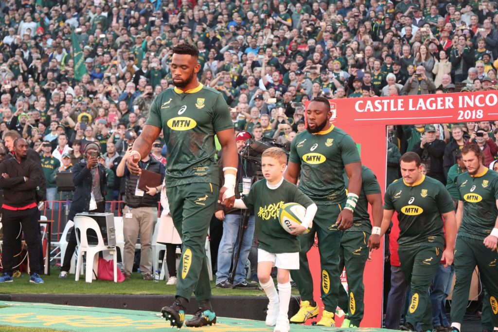 Siya Kolisi leads the Springboks out for the first time