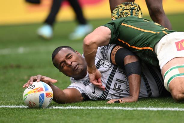 Fijis Josua Vakurinabili, #1, scores a try past South Africas Impi Visser, #3, during the Fiji vs South Africa match on the second day of the Los Angeles 2023 World Rugby Sevens Series event at Dignity Health Sports Park in Carson, California, on February 26, 2023. (Photo by Patrick T. Fallon / AFP)