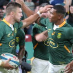 epa10119226 South Africa's Handre Pollard (L) and Damian Willemse (R) celebrate a try during the 2022 Rugby Championship match between South Africa and New Zealand held at the Ellis Park Stadium, Johannesburg, South Africa, 13 August 2022.