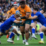 Australia's lock Will Skelton (C) is tackled during the rugby union Test match between Italy and Australia on November 12, 2022 at the Artemio-Franchi stadium in Florence, Tuscany.