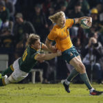 Australia's fly-half Carter Gordon (R) is tackled by South Africa's back row Evan Roos during the Rugby Championship first round match between South Africa and Australia at Loftus Versfeld stadium in Pretoria on July 8, 2023.