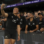 New Zealand's Caleb Clarke poses for a selfie with fans during the Rugby Championship and 2023 Bledisloe Cup match between Australia and New Zealand at Melbourne Cricket Ground in Melbourne on July 29, 2023.