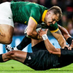 LONDON, ENGLAND - AUGUST 25: Andre Esterhuizen of South Africa is tackled by Richie Mo'unga of New Zealand during the Summer International match between New Zealand All Blacks v South Africa at Twickenham Stadium on August 25, 2023 in London, England. (Photo by David Rogers/Getty Images)