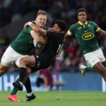 South Africa's centre Andre Esterhuizen (L) is tackeld by New Zealand's fly-half Richie Mo'unga (C) during the pre-World Cup Rugby Union match between New Zealand and South Africa at Twickenham Stadium in west London, on August 25, 2023.