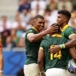 BORDEAUX, FRANCE - SEPTEMBER 17: Grant Williams of South Africa celebrates with Damian Willemse and Canan Moodie of South Africa after scoring his team's seventh try during the Rugby World Cup France 2023 match between South Africa and Romania at Nouveau Stade de Bordeaux on September 17, 2023 in Bordeaux, France. (Photo by Adam Pretty - World Rugby/World Rugby via Getty Images)