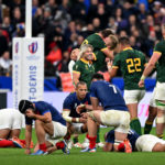 PARIS, FRANCE - OCTOBER 15: The players of France look dejected as the players of South Africa celebrate victory at full-time following the Rugby World Cup France 2023 Quarter Final match between France and South Africa at Stade de France on October 15, 2023 in Paris, France. (Photo by Mike Hewitt/Getty Images)