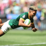 CAPE TOWN, SOUTH AFRICA - DECEMBER 09: Ronald Brown of South Africa dives over to score a try during day 1 of the HSBC SVNS Cape Town at DHL Stadium on December 09, 2023 in Cape Town, South Africa.