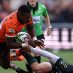 AMSTERDAM, NETHERLANDS - JANUARY 14: Ali Mgijima of Toyota Cheetahs is tackeld and stopped by Thomas Carol of Section Paloise during the EPCR Challenge Cup match between Toyota Cheetahs and Section Paloise at NRCA Stadium on January 14, 2024 in Amsterdam, Netherlands. (Photo by Dean Mouhtaropoulos/Getty Images)