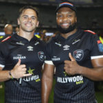 DURBAN, SOUTH AFRICA - NOVEMBER 25: Rohan Janse van Rensburg of the Hollywoodbets Sharks with Lukhanyo Am of the Hollywoodbets Sharks during the United Rugby Championship match between Hollywoodbets Sharks and Dragons at Hollywoodbets Kings Park on November 25, 2023 in Durban, South Africa. (Photo by Steve Haag Sports/Gallo Images)
