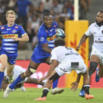 Hacjivah Dayimani of the Stormers runs at Jaden Hendrikse of the Sharks during the 2023 United Rugby Championship game between the Stormers and Sharks at Cape Town Stadium on 30 December 2023 ©Ryan Wilkisky/BackpagePix