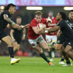 CARDIFF, WALES - NOVEMBER 05: Nick Tompkins of Wales is tackled by Rieko Ioane (L) and Sevu Reece during the Autumn International match between Wales and New Zealand All Blacks at the Principality Stadium on November 05, 2022 in Cardiff, Wales. (Photo by David Rogers/Getty Images)