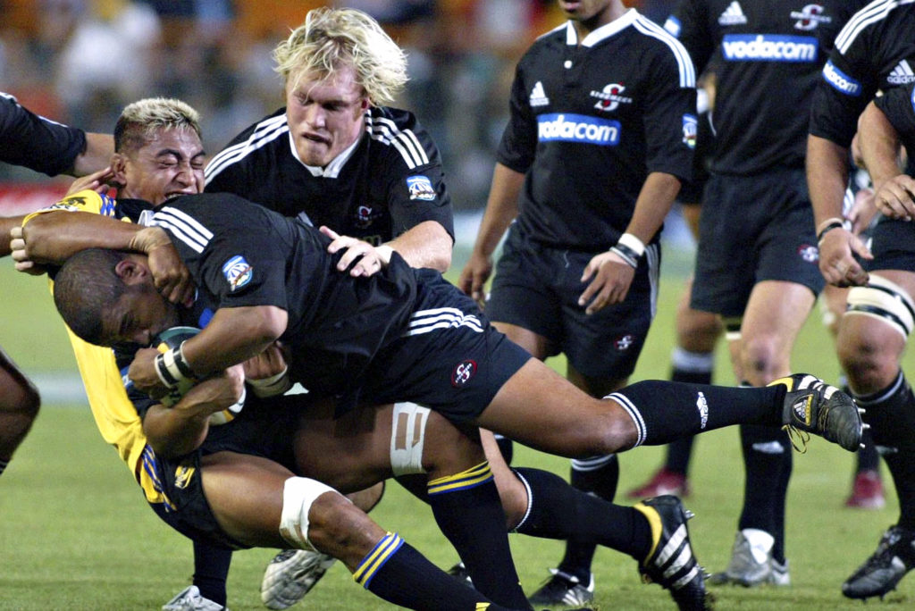 Photo: Gallo Images 11 March 2006. Super 14 , Stormers vs Hurricanes at Newlands ,Cape Town. Eddie Andrews goes down with the ball and Schalk Burger supports him.