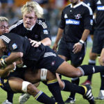 Photo: Gallo Images 11 March 2006. Super 14 , Stormers vs Hurricanes at Newlands ,Cape Town. Eddie Andrews goes down with the ball and Schalk Burger supports him.