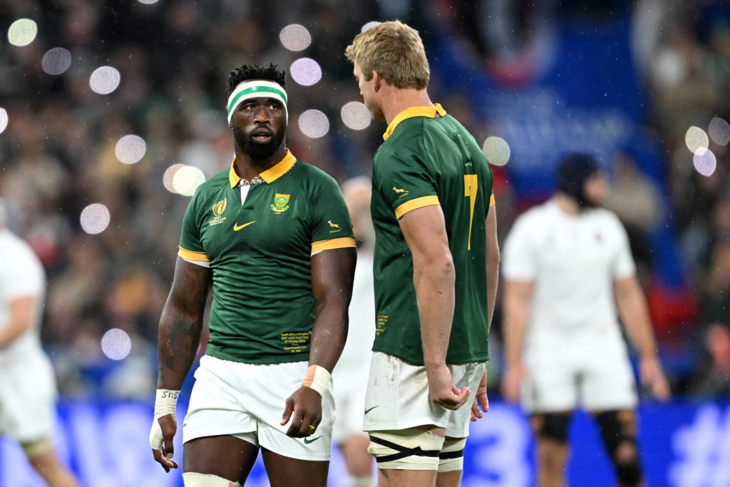 PARIS, FRANCE - OCTOBER 21: Siya Kolisi of South Africa interacts with teammate Pieter-Steph Du Toit during the Rugby World Cup France 2023 match between England and South Africa at Stade de France on October 21, 2023 in Paris, France. (Photo by Hannah Peters/Getty Images)