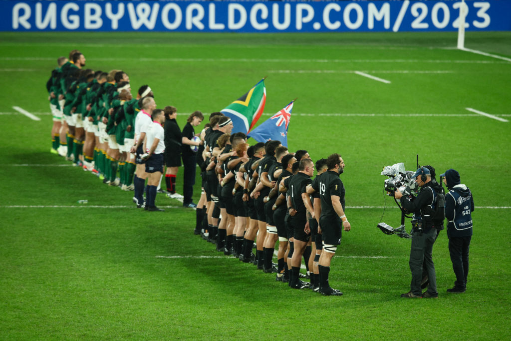 PARIS, FRANCE - OCTOBER 28: The teams stand for the national anthems prior to the Rugby World Cup France 2023 Gold Final match between New Zealand and South Africa at Stade de France on October 28, 2023 in Paris, France. (Photo by Craig Mercer/MB Media/Getty Images)