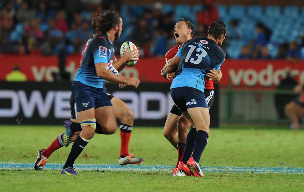 PRETORIA, SOUTH AFRICA - MARCH 28: Israel Dagg of Crusaders get a tackle after releasing the ball from JJ Engelbrecht of Vodacom Bulls during the Super Rugby match between Vodacom Bulls and Crusaders at Loftus Versfeld on March 28, 2015 in Pretoria, South Africa. (Photo by Gallo Images)