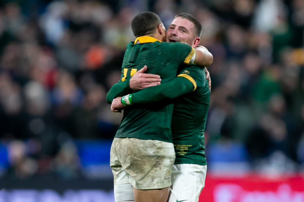 PARIS, FRANCE - OCTOBER 28: Cheslin Kolbe of South Africa embraces Willie Le Roux of South Africa following their victory in the Rugby World Cup 2023 final match between New Zealand and South Africa at Stade de France on October 28, 2023 in Paris, France. (Photo by Juan Jose Gasparini/Gallo Images)