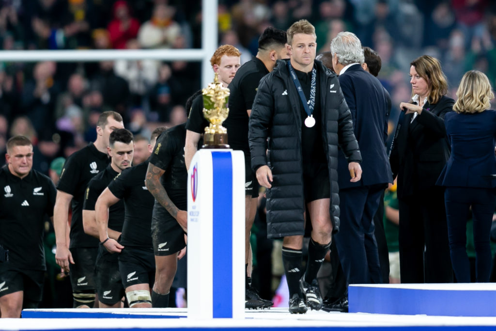 PARIS, FRANCE - OCTOBER 28: Sam Cane of New Zealand walks past the Webb Ellis cup with their runner's up medal following the Rugby World Cup 2023 final match between New Zealand and South Africa at Stade de France on October 28, 2023 in Paris, France. (Photo by Juan Jose Gasparini/Gallo Images)